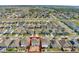 An aerial view of the home with a red boundary line in a suburban community at 269 Ludisia Loop, Davenport, FL 33837