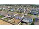 An aerial view of the home and its surrounding neighborhood in a suburban community at 269 Ludisia Loop, Davenport, FL 33837