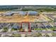 An aerial street view of the home within a red boundary line on a sunny day at 269 Ludisia Loop, Davenport, FL 33837