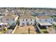 An aerial view of the home's backyard featuring a patio and plenty of room for activities at 269 Ludisia Loop, Davenport, FL 33837