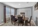 Formal dining area featuring a sophisticated dark wood table, six chairs, and elegant wall decor at 269 Ludisia Loop, Davenport, FL 33837