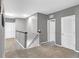 Upstairs hallway is carpeted and has three doors: two closet doors and one bedroom door at 269 Ludisia Loop, Davenport, FL 33837