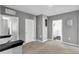 Upstairs landing features carpet flooring, two doors, and a small corner perfect for reading at 269 Ludisia Loop, Davenport, FL 33837