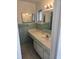Bathroom with a vanity featuring ample counter space and storage cabinets, complemented by bright lighting at 2817 Fitzooth Dr, Winter Park, FL 32792