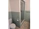 Bathroom showcasing a walk-in shower and a toilet with vintage tile accents, maximizing space and functionality at 2817 Fitzooth Dr, Winter Park, FL 32792