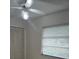 This bedroom features a ceiling fan, a window for natural light, and a closet with folding doors at 2817 Fitzooth Dr, Winter Park, FL 32792
