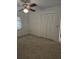 Bedroom with standard closet, carpet flooring and ceiling fan with window to let light in at 2817 Fitzooth Dr, Winter Park, FL 32792