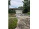 A house exterior showing a two car garage and cracked concrete driveway at 2817 Fitzooth Dr, Winter Park, FL 32792
