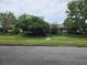 Charming single-story home with lush landscaping and mature trees lining the front yard at 2817 Fitzooth Dr, Winter Park, FL 32792