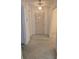 Inviting foyer with terrazzo flooring, a modern light fixture, and a door leading to the rest of the home at 2817 Fitzooth Dr, Winter Park, FL 32792