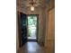 Welcoming foyer with an open door, showing the front yard and terrazzo flooring at 2817 Fitzooth Dr, Winter Park, FL 32792
