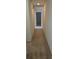 Neutral hallway featuring a carpeted floor, light fixtures, and access to various rooms in the home at 2817 Fitzooth Dr, Winter Park, FL 32792