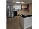 Functional kitchen with stainless steel refrigerator, black dishwasher, and bright cabinetry at 2817 Fitzooth Dr, Winter Park, FL 32792
