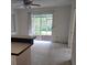 Inviting living room with neutral tones, a ceiling fan, and a sliding glass door to the lanai at 2817 Fitzooth Dr, Winter Park, FL 32792