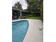 Backyard view showcasing a well-maintained pool area and lush landscaping, ideal for outdoor enjoyment at 2817 Fitzooth Dr, Winter Park, FL 32792