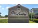 Econ Landing community sign on a gray stone base with manicured landscaping around the sign at 2936 Econ Landing Blvd, Orlando, FL 32825