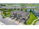New townhome exterior displaying brick paved driveways, manicured bushes, garages, and colorful siding at 2936 Econ Landing Blvd, Orlando, FL 32825