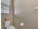 Neutral half bathroom with toilet and window offering natural light at 2936 Econ Landing Blvd, Orlando, FL 32825