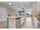 Bright kitchen featuring an island with a breakfast bar and stainless steel appliances at 2936 Econ Landing Blvd, Orlando, FL 32825