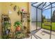 Screened patio with plants and outdoor decor at 2936 Econ Landing Blvd, Orlando, FL 32825