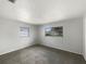 Clean, carpeted bedroom with neutral walls and natural light creating a serene and inviting space at 300 Avenue E Se, Winter Haven, FL 33880