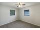 Bedroom with two windows and a ceiling fan at 300 Avenue E Se, Winter Haven, FL 33880