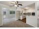 Cozy kitchen and dining area with white cabinetry and appliances at 300 Avenue E Se, Winter Haven, FL 33880