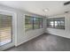 Living room features lots of natural light from many windows and a backyard door at 300 Avenue E Se, Winter Haven, FL 33880