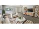 Bright living room features a comfortable seating area with stylish decor and a cozy rug at 300 Avenue E Se, Winter Haven, FL 33880