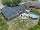 Aerial view of the backyard showcasing the patio, above-ground pool, and green space, ideal for outdoor enjoyment at 3362 Partridge St, Deltona, FL 32738