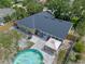 Aerial view of backyard displaying pool, patio, and landscaping at 3362 Partridge St, Deltona, FL 32738