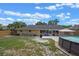 Spacious backyard offering a combination of grass, patio, above-ground pool, and outdoor space at 3362 Partridge St, Deltona, FL 32738