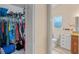 Walk-in closet with an abundance of storage space next to a bathroom at 3362 Partridge St, Deltona, FL 32738