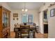 Inviting dining room featuring hardwood floors, a wooden dining table set, and decorative wall art at 3362 Partridge St, Deltona, FL 32738