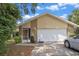 Charming single Gathering home with a two car garage and well manicured lawn and a screened in porch at 3362 Partridge St, Deltona, FL 32738