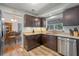 Open kitchen showcases granite counters, stainless appliances, and ample dark-wood cabinetry at 3362 Partridge St, Deltona, FL 32738