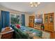 Bright and inviting living room featuring vaulted ceilings, a window with a view, and a comfortable sofa at 3362 Partridge St, Deltona, FL 32738