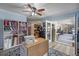 Well-lit office/craft room featuring wood floors, sewing machine station, and ample storage at 3362 Partridge St, Deltona, FL 32738