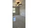 A cozy bedroom featuring tiled floors, a ceiling fan, and a window for natural light at 3391 Orchid Dr, Indian Lake Estates, FL 33855
