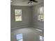 Bedroom features tile flooring and a window overlooking a natural setting at 3391 Orchid Dr, Indian Lake Estates, FL 33855