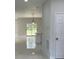 An interior view shows modern tile floors and bright natural light at 3391 Orchid Dr, Indian Lake Estates, FL 33855