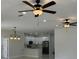 Open floor plan view of kitchen with modern appliances flowing to living space at 3391 Orchid Dr, Indian Lake Estates, FL 33855