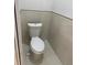 A clean, modern toilet with tile accents in a bathroom setting at 3391 Orchid Dr, Indian Lake Estates, FL 33855