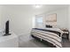 Comfortable bedroom featuring neutral decor, a large bed, and ample space, creating a peaceful retreat at 4063 Roaming Brook Dr, Apopka, FL 32712