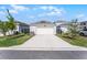 Detached two-car garage with a concrete driveway and some landscaping at 4063 Roaming Brook Dr, Apopka, FL 32712