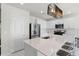 Stylish kitchen with white cabinets, stainless steel appliances, and a large island with seating at 4063 Roaming Brook Dr, Apopka, FL 32712