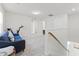 Cozy upstairs living area featuring comfortable seating, neutral colors, and easy access to other rooms at 4063 Roaming Brook Dr, Apopka, FL 32712