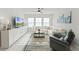 Bright and airy living room features lots of natural light, a comfortable sofa, and stylish decor at 4063 Roaming Brook Dr, Apopka, FL 32712