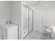 Contemporary shower features a glass door, white subway tile, and modern fixtures at 4063 Roaming Brook Dr, Apopka, FL 32712