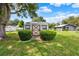 Backyard shed surrounded by green landscaping, adding utility and charm to the property at 409 Jumper S Dr, Bushnell, FL 33513